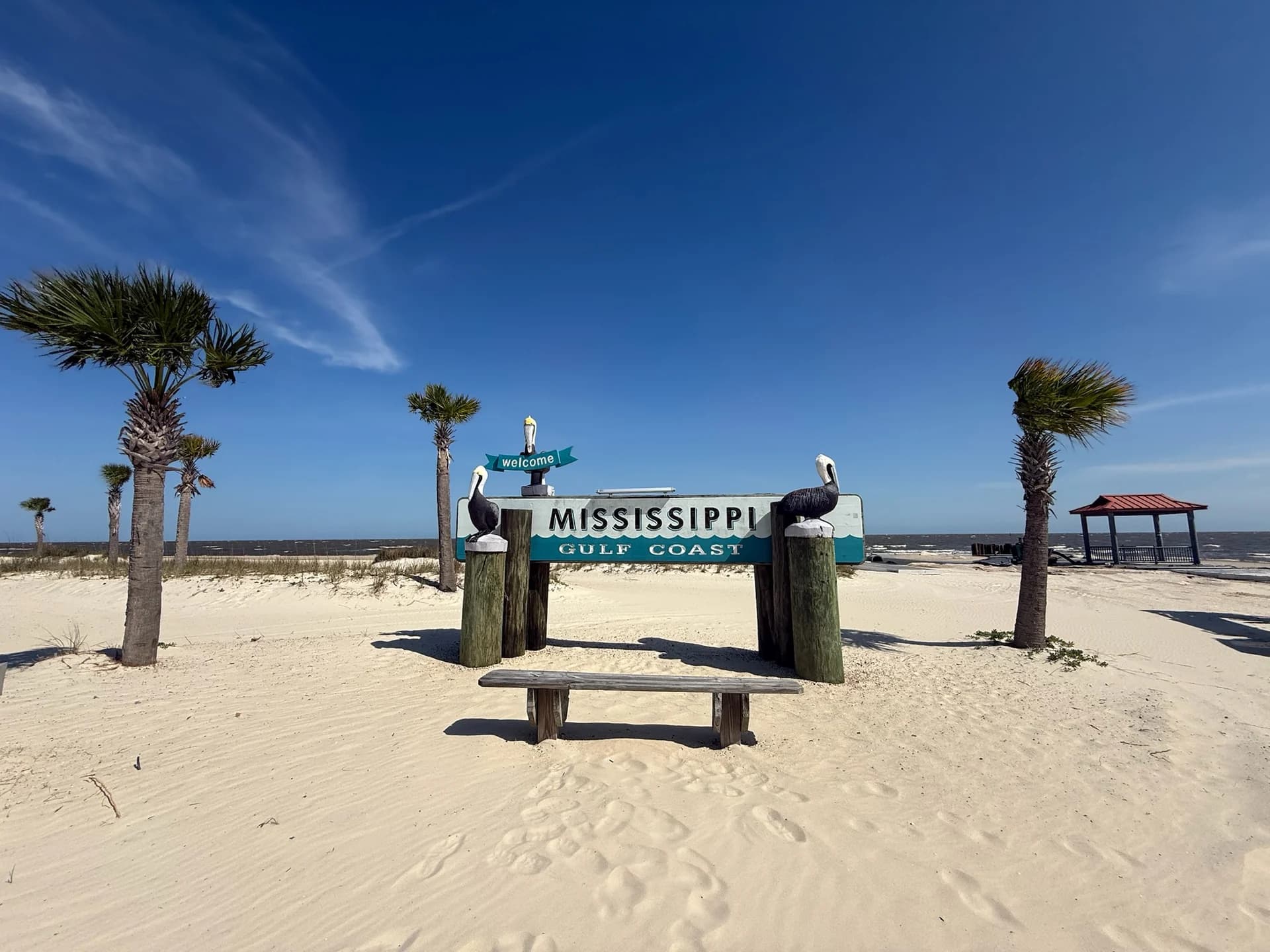 Mississippi Gulf Coast beach landmark framed by palms in Gulfport